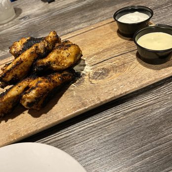 Flamme Burger - Keystone - Wings. Garlic aioli. Pass on the aioli and get the chipotle bbq that's what we did! - Burgers Near Me - Indianapolis, Indiana