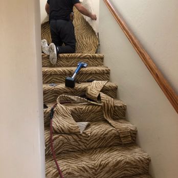 Murillo's Carpet Service - a man on the stairs - Carpet Installation Near Me Murillo's Carpet Service - a man on the stairs - Carpet Installation Near Me