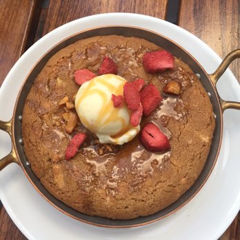 NoMI - Freshly baked hot skillet cookie a la mode with dehydrated strawberries - Bars Near Me - Chicago, Illinois