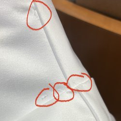 Angel Rivera Bridal Atelier - Sloppy work, these stitches should be on the inside if necessary at all. Not present for all to see.