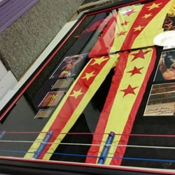 Art & Frame Emporium - Creme' da la creme' Randy Macho Man Savages signed uniform and photos. Hand built wrestling ring with and access door.