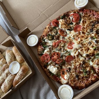 Cosmic Pizza - Parmesan & Garlic Bread Stix, build your own cosmic pizza, cosmic sauce - Pizza Near Me - Bozeman, Montana