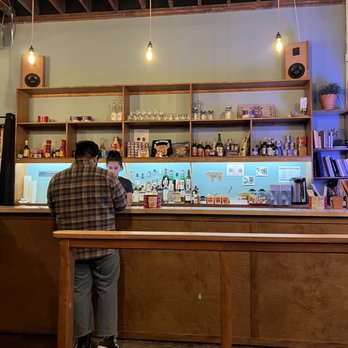 28 Tigers - a man sitting at a bar - Chinese Near Me - Portland, Oregon