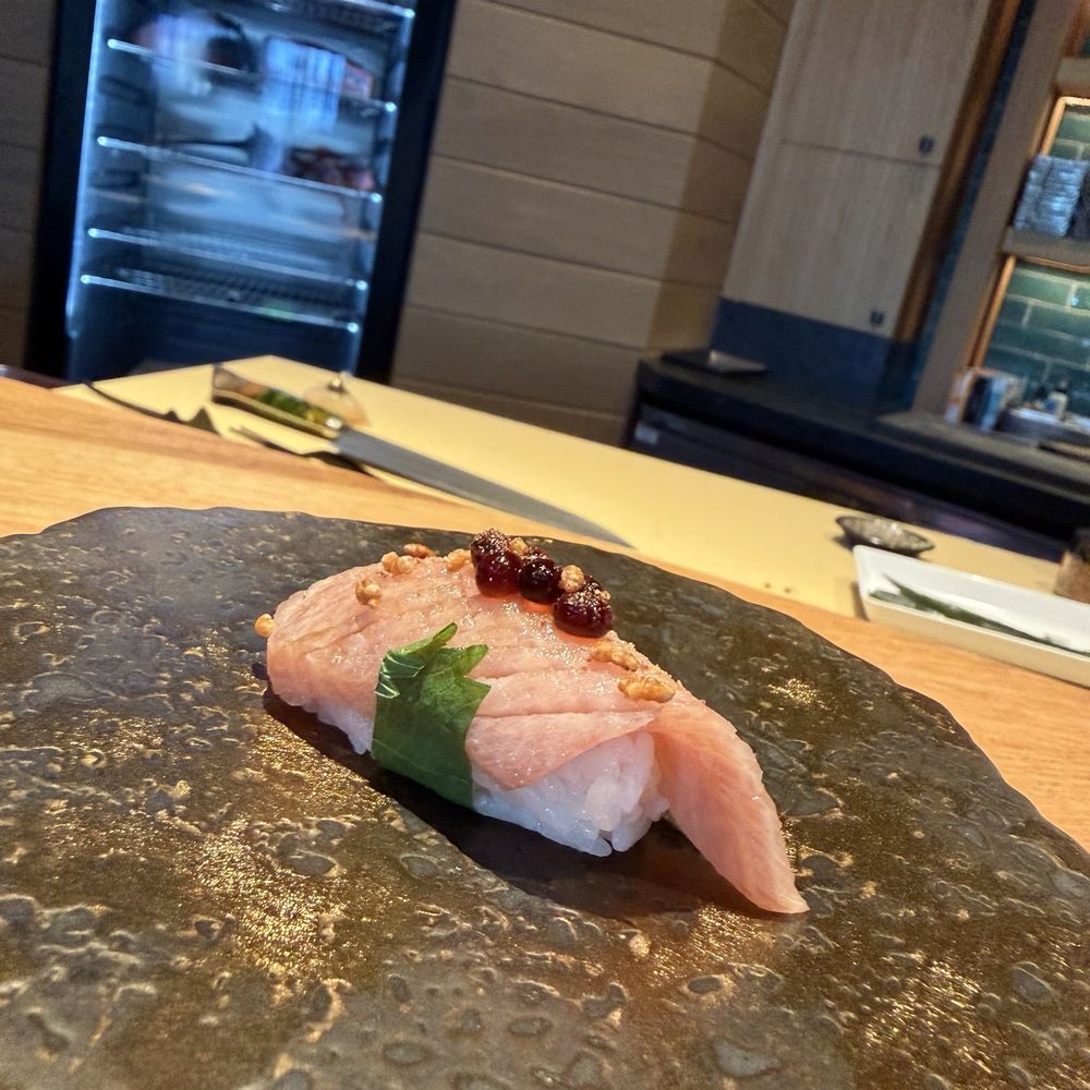 Kaiya Omakase - Second piece of O-toro with soy pearls on top and shiso leaf garnish - Sushi Bars Near Me - Newport Beach, California