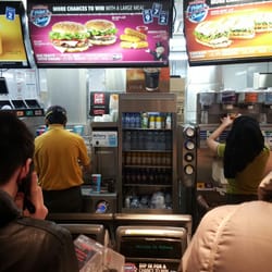 Mcdonalds - Staff hard at work behind the counter.