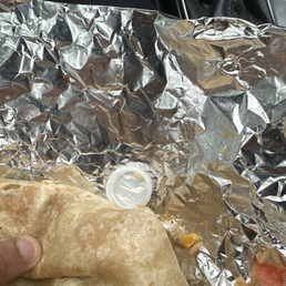 Water bottle cap inside wrapped with burrito Water bottle cap inside wrapped with burrito