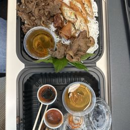 Cold vermicelli noodles with grilled pork and spring rolls.