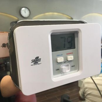 ASAP Glass & Mirror - horrific cut job around the thermostat, note that the thermostat faceplate was taken off when they cut it. - Windows Installation Near Me - Van Nuys, California
