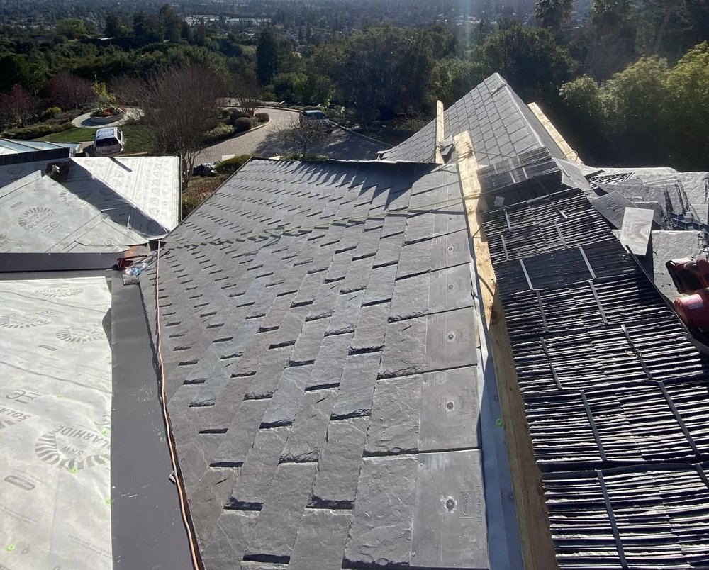 Slide of Exclusively Roofing