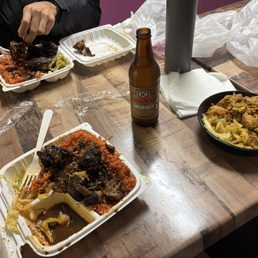 Oxtail, brown stew chicken, curry chicken on Jollof Rice Oxtail, brown stew chicken, curry chicken on Jollof Rice