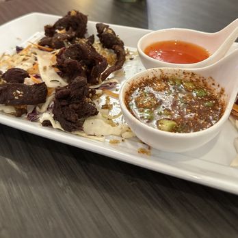 Thai Halal Bistro - Thai beef jerky. Very similar to Szechuan crispy spicy beef. The brown sauce is absolutely delicious. Spicy and tangy. - Thai Near Me - Missouri City, Texas Thai Halal Bistro - Thai beef jerky. Very similar to Szechuan crispy spicy beef. The brown sauce is absolutely delicious. Spicy and tangy. - Thai Near Me - Missouri City, Texas