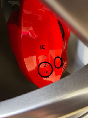 Photo of Onsite Wheels - Garden Grove, CA, US. Passenger side rear caliper big paint drip/run. Also run/bubble to the right of logo.