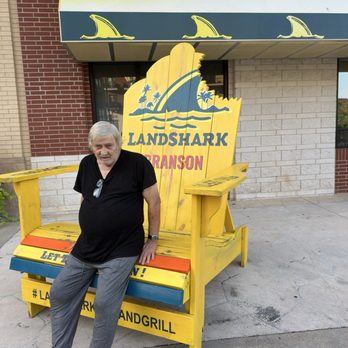 LandShark Bar & Grill - Branson - my husband leaning against the restaurants advertisement - Seafood Near Me - Branson, Missouri