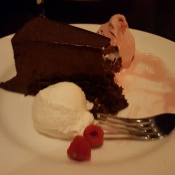 J. Gilbert's Wood-Fired Steaks & Seafood - Velvet chocolate cake with raspberry ice cream. - Steakhouses Near Me - Overland Park, Kansas J. Gilbert's Wood-Fired Steaks & Seafood - Velvet chocolate cake with raspberry ice cream. - Steakhouses Near Me - Overland Park, Kansas