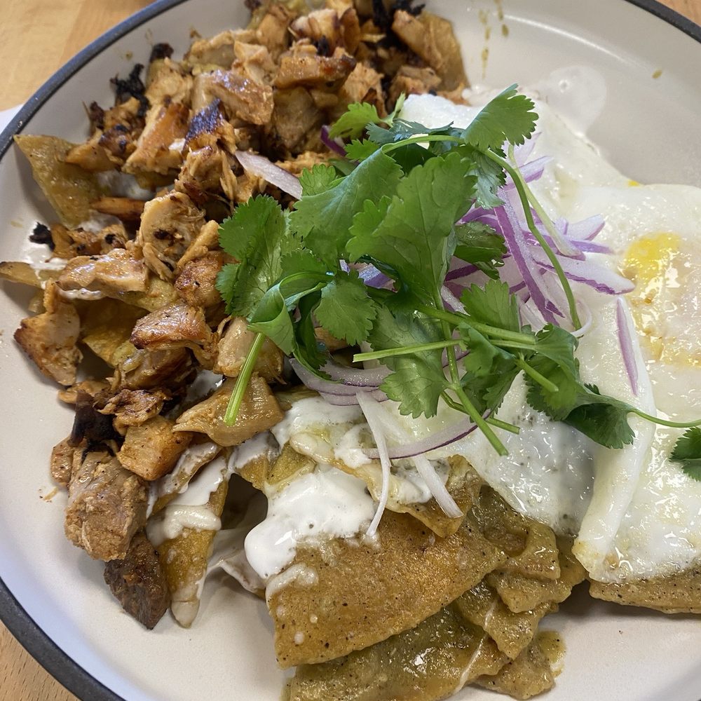 SeD Cocina - Green chilaquiles, over medium eggs, added chicken - Mexican Near Me - Montclair, California SeD Cocina - Green chilaquiles, over medium eggs, added chicken - Mexican Near Me - Montclair, California