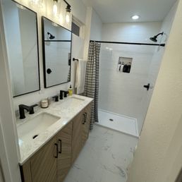 a bathroom with marble counter tops