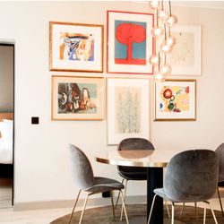 Radisson Blu Atlantic Hotel - Suite. Big living room with a lounge and dining table and bathroom. A separate bedroom with bathroom.