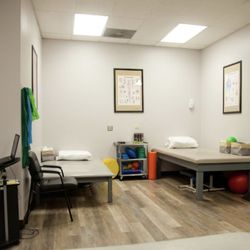 West Point Physical Therapy Center - Padded exercise tables of varying heights.