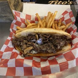 Steak and cheese sandwich- awesomely tasty w/ fries