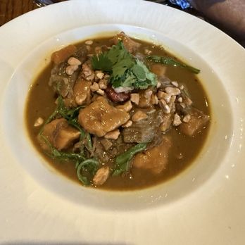Compère Lapin - Goat curry with yam gnocchi and peanuts - Caribbean Near Me - New Orleans, Louisiana Compère Lapin - Goat curry with yam gnocchi and peanuts - Caribbean Near Me - New Orleans, Louisiana
