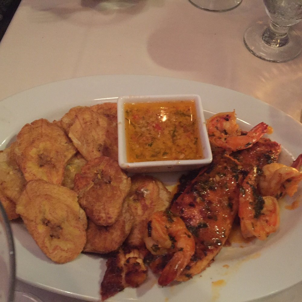 Coquito - One of the specials of the night Salmon & Shrimp with fried green plantains. - Latin American Near Me - Warwick, New York Coquito - One of the specials of the night Salmon & Shrimp with fried green plantains. - Latin American Near Me - Warwick, New York
