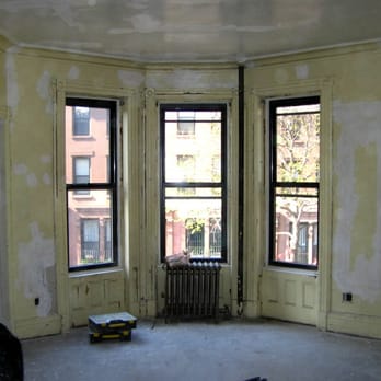 Time To Renovate - an empty room with a radiator - Flooring Near Me - Brooklyn, New York Time To Renovate - an empty room with a radiator - Flooring Near Me - Brooklyn, New York