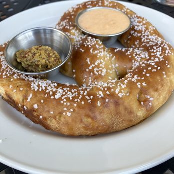 Staymaker at Journeyman Distillery - Pretzel with mustard and cheese - Pizza Near Me - Three Oaks, Michigan Staymaker at Journeyman Distillery - Pretzel with mustard and cheese - Pizza Near Me - Three Oaks, Michigan