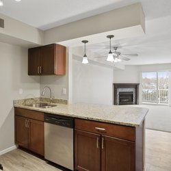 Waterford Place Townhomes - Kitchens are complete with rangehood microwave, electric stove and range, dishwasher, and fridge/freezer.