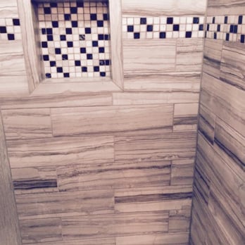 Eze Flooring - a bathroom with a tiled shower - Flooring Near Me - Moreno Valley, California Eze Flooring - a bathroom with a tiled shower - Flooring Near Me - Moreno Valley, California