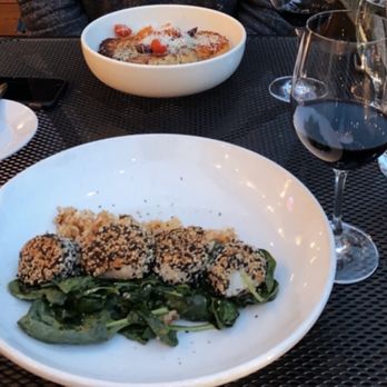 Fins Bistro - Sesame-Crusted scallops perfectly cooked on a bed of spinach with kimchi rice. - Seafood Near Me - Issaquah, Washington Fins Bistro - Sesame-Crusted scallops perfectly cooked on a bed of spinach with kimchi rice. - Seafood Near Me - Issaquah, Washington