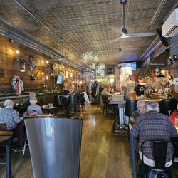 The Roost - Comfortable seating at hightops, tables and bar and beautiful embossed tin ceilings.