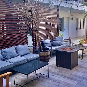 La Villa - a patio with furniture and trees - Tapas Bars Near Me - Fort Lauderdale, Florida La Villa - a patio with furniture and trees - Tapas Bars Near Me - Fort Lauderdale, Florida