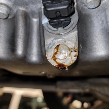 Jiffy Lube - You can see the "caulking" they placed over my oil pan and the oil leaking out. - Auto Repair Near Me - Huntington Beach, California Jiffy Lube - You can see the "caulking" they placed over my oil pan and the oil leaking out. - Auto Repair Near Me - Huntington Beach, California