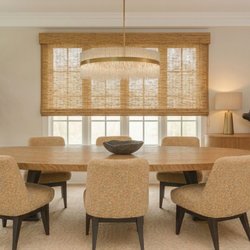 Ego Blinds by Viala Living - Provenance® Woven Wood Shades add rich organic texture and soft, warm light to this dining space for an expansive look.