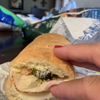 Port of Subs - a person holding a sandwich - Sandwiches Near Me - Gilbert, Arizona Port of Subs - a person holding a sandwich - Sandwiches Near Me - Gilbert, Arizona