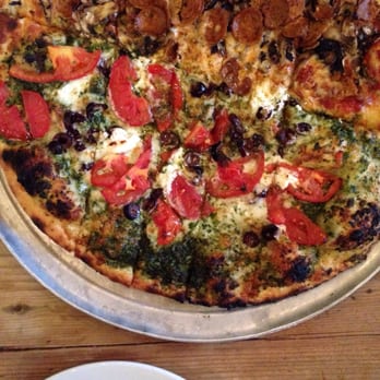 Flatbread Company - Bottom half Pele's Pesto (LOVE!), top half Pepperoni Mushroom. Not a fan of the nitrate-free pepperoni. - Pizza Near Me - Paia, Hawaii