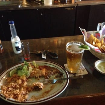 Casa Durango - What's left of my enchiladas rancheros (highly recommend) a smooth modelo and a shot of tequila with chips and salsa verde - Mexican Near Me - Renton, Washington