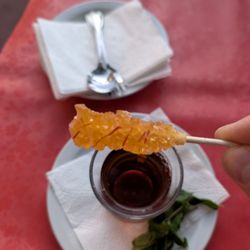 M Cafe & Grill - Sugar and saffron rock candy style stick to mix into tea!