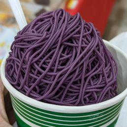 a bowl of purple noodles