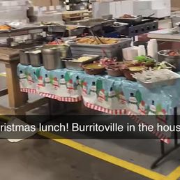 a table full of food in a warehouse
