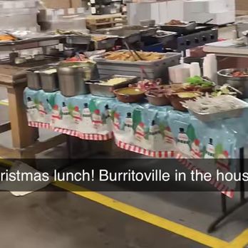 Burritoville - a table full of food in a warehouse - Mexican Near Me - Dekalb, Illinois