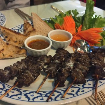 Juree's Thai Place - Satay beef skewers. Whole wheat bread on the side... not very appalling to eat or look at. - Thai Near Me - Calgary, Alberta Juree's Thai Place - Satay beef skewers. Whole wheat bread on the side... not very appalling to eat or look at. - Thai Near Me - Calgary, Alberta
