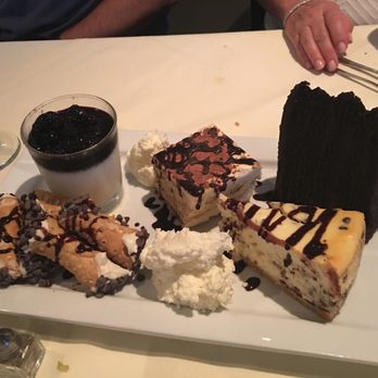Pescatore - Desserts -- Panna cotta with blueberry compote, tiramisu, chocolate cake, cannolis, fresh whipped creme and chocolate chip cheesecake - Seafood Near Me - Bala Cynwyd, Pennsylvania Pescatore - Desserts -- Panna cotta with blueberry compote, tiramisu, chocolate cake, cannolis, fresh whipped creme and chocolate chip cheesecake - Seafood Near Me - Bala Cynwyd, Pennsylvania