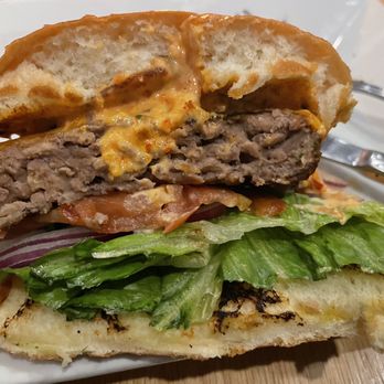 Red Rock Trattoria - a hamburger with meat and lettuce - Italian Near Me - Waterton, Alberta Red Rock Trattoria - a hamburger with meat and lettuce - Italian Near Me - Waterton, Alberta
