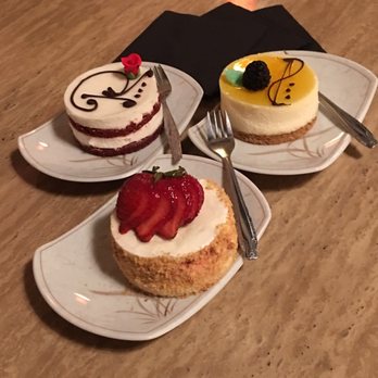 Tiny Pyramid - Top Left-Red Velvet Cheesecake Top Right-Lilikoi Cheesecake  Bottom-Strawberry Cheesecake - Cafes Near Me - Honolulu, Hawaii