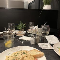 Mario’s 410 Grille - The stack of dirty dishes that sat on our table for the entire meal.