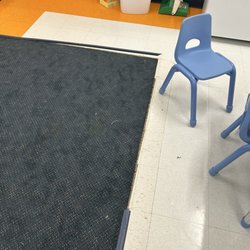 The Learning Experience - Trumbull - More broken rugs in a room they is actively in use.