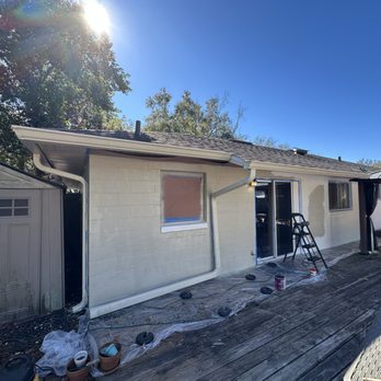 Sam Handyman - Painting exterior walls on the backyard - Handyman Near Me