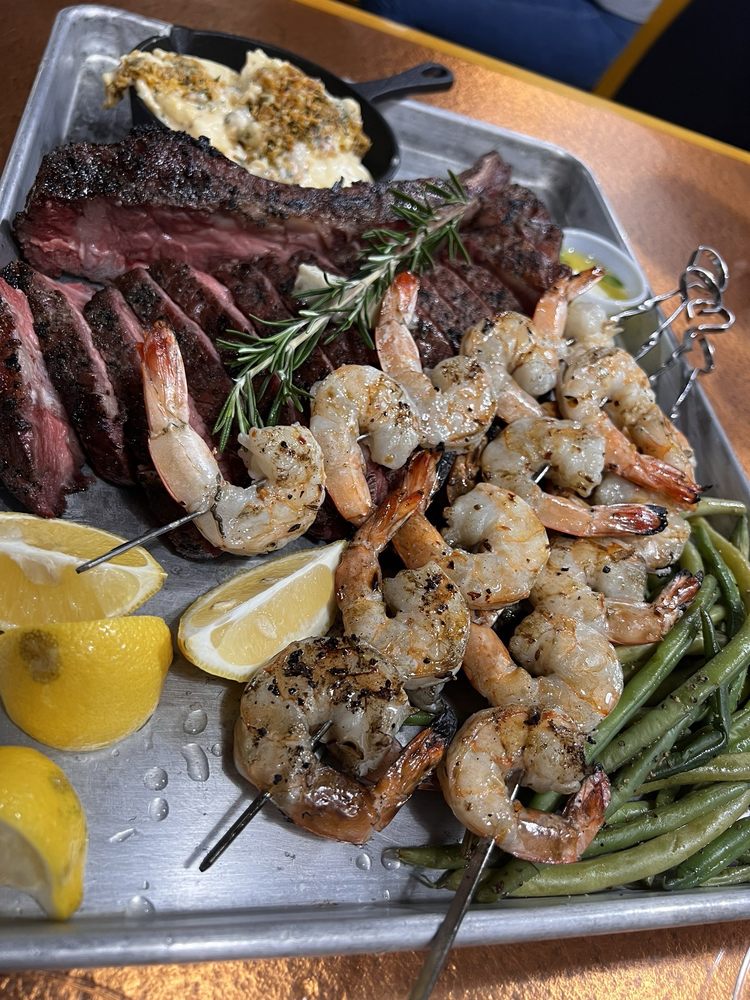 S & T Cafe Grill Logo