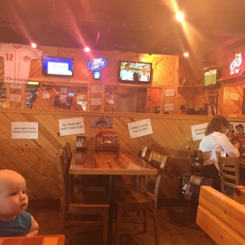 Roosters - a baby sitting at a table in a restaurant - American Near Me - Milford, Ohio Roosters - a baby sitting at a table in a restaurant - American Near Me - Milford, Ohio